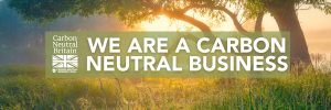 we are a carbon neutral business logo on top of a forest background